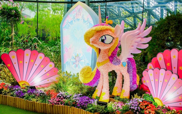 My Little Pony floral sculpture at Gardens by the Bay, Singapore, surrounded by vibrant flowers.