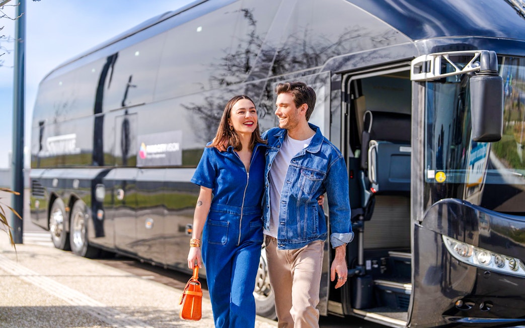 Couple exiting Paris City Vision bus for Monet's House and Gardens tour.