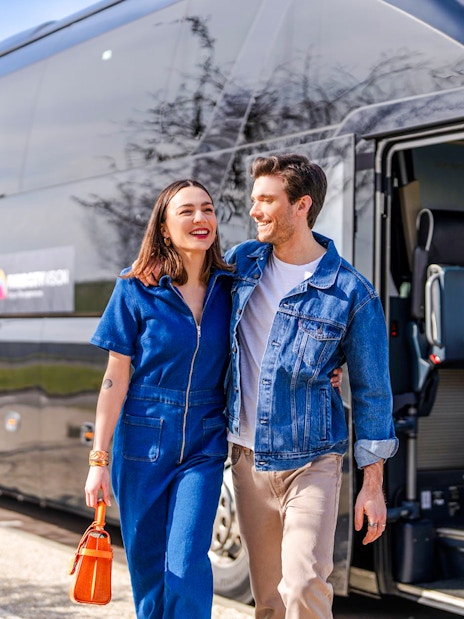 Couple exiting Paris City Vision bus for Monet's House and Gardens tour.