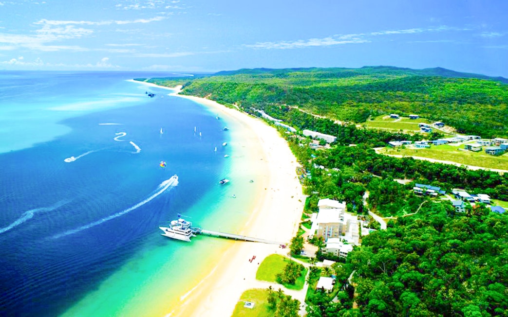 Aerial view of Tangalooma Resort on Moreton Island with sandy beaches and blue waters.