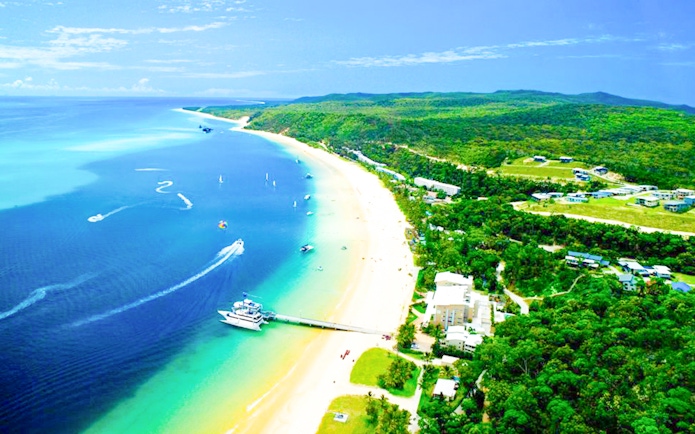 Aerial view of Tangalooma Resort on Moreton Island with sandy beaches and blue waters.