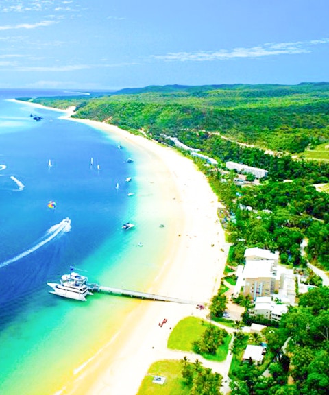 Aerial view of Tangalooma Resort on Moreton Island with sandy beaches and blue waters.