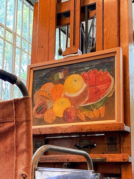 Wheelchair and easel with fruit painting at Frida Kahlo Museum, Mexico City.