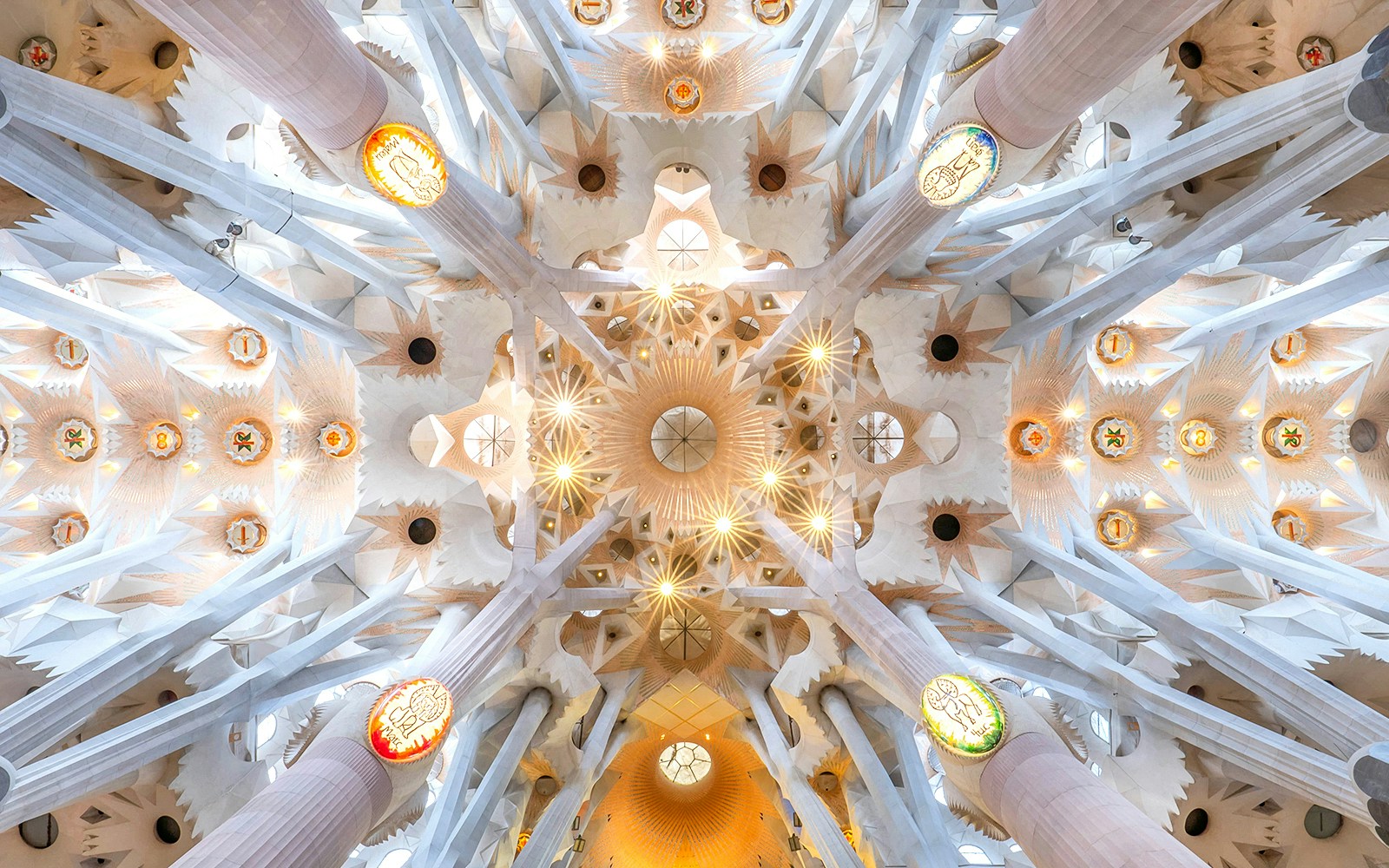 Sagrada Familia interior with tourists using audio guides, Barcelona, Spain.
