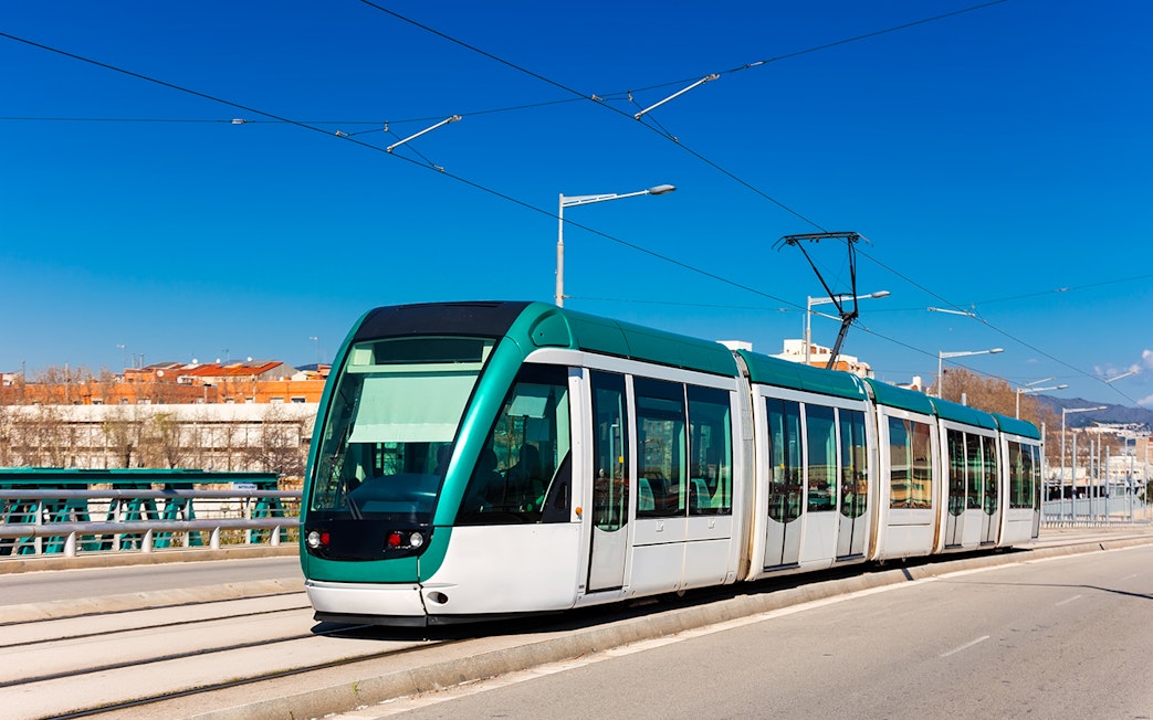 Barcelona tram used by tourists with Turbopass City Card for exploring attractions.