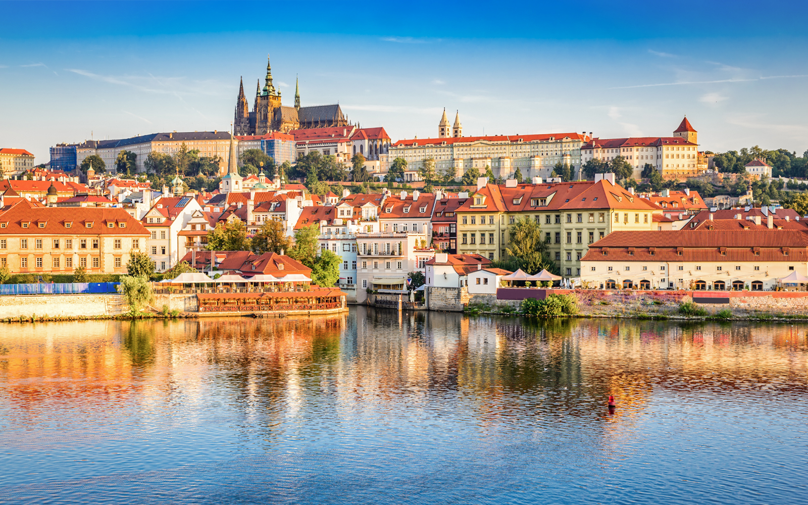 Prague Castle view from a boat on the Vltava River.