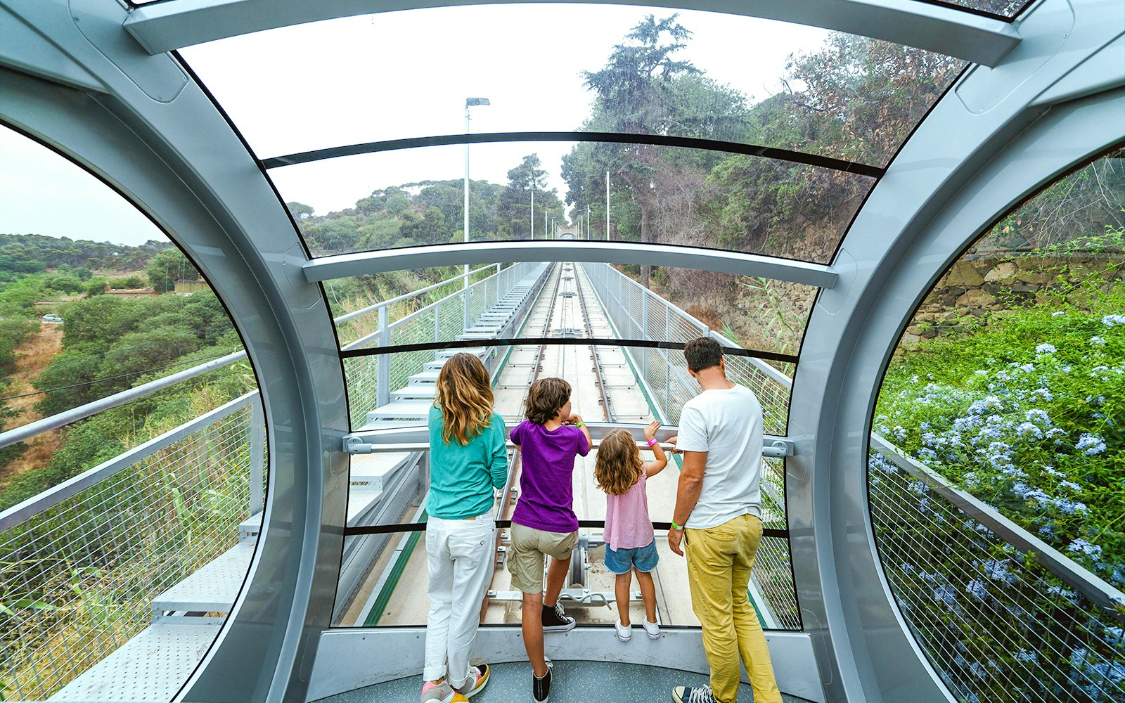Interior view of funicular at Tibidabo Amusement Park with passengers looking out.