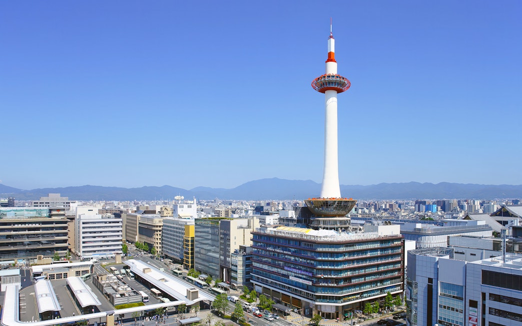 Kyoto Tower overlooking cityscape in Kyoto, Japan.