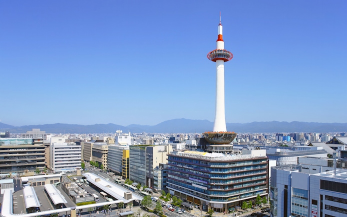 Kyoto Tower overlooking cityscape in Kyoto, Japan.