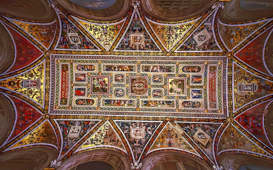 Ceiling frescoes of Siena Cathedral, Italy, showcasing intricate religious artwork.
