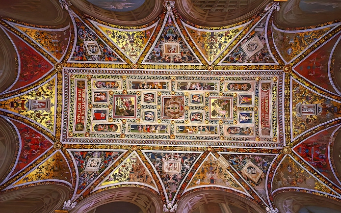 Ceiling frescoes of Siena Cathedral, Italy, showcasing intricate religious artwork.