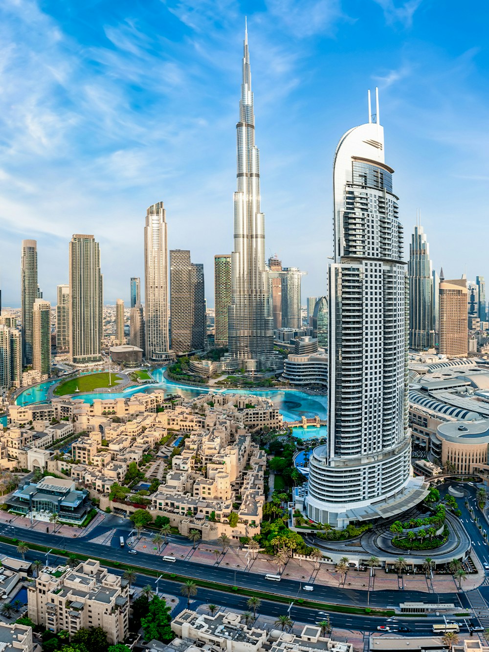 Panoramic view of Dubai's Business Bay skyline featuring the Burj Khalifa.