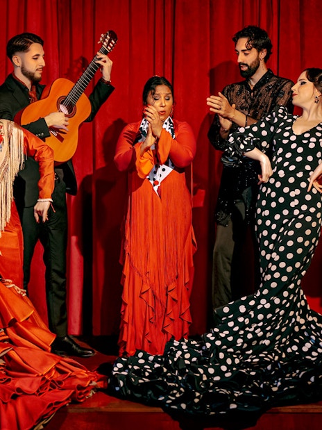 Flamenco dancers and guitarist performing on stage at Laietana, Barcelona.