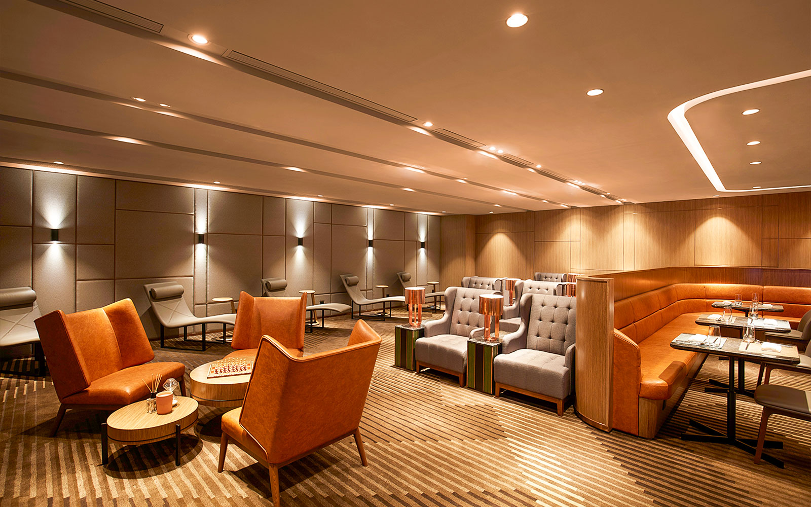 First-class lounge seating area at Hong Kong International Airport.