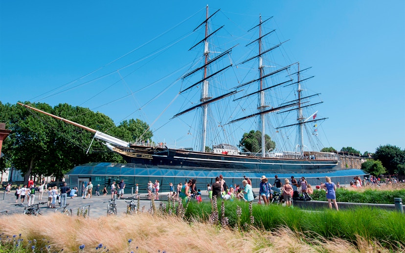Cutty Sark ship at National Maritime Museum, London, with visitors nearby.