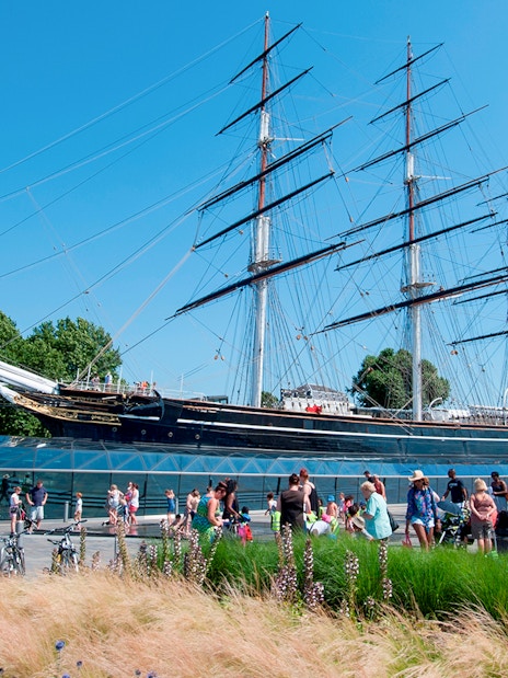 Cutty Sark ship at National Maritime Museum, London, with visitors nearby.