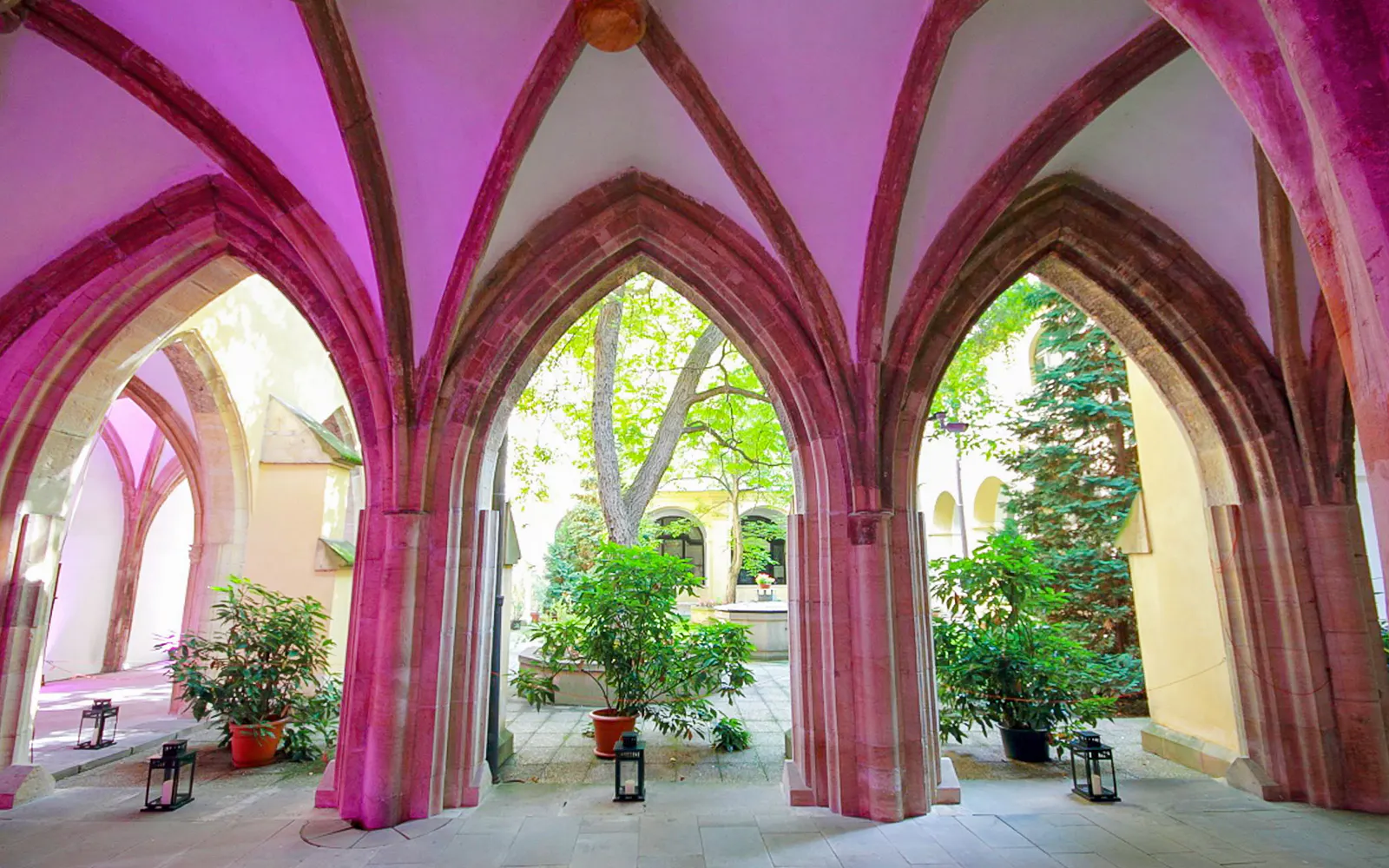 Gothic arches and courtyard inside Minorite monastery of St James, Prague.