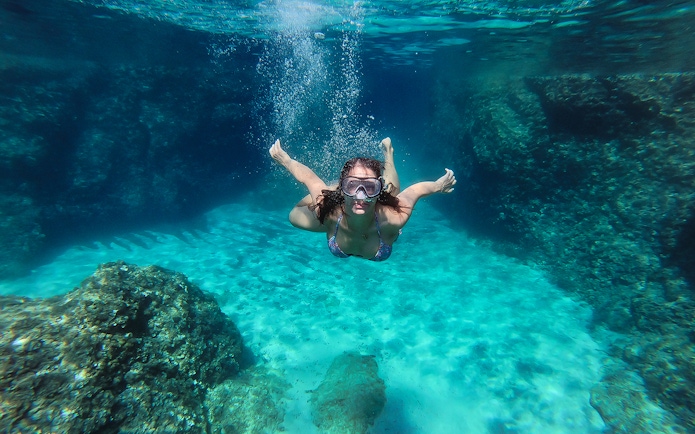 Snorkeler exploring underwater near Blue Cave, Dubrovnik.