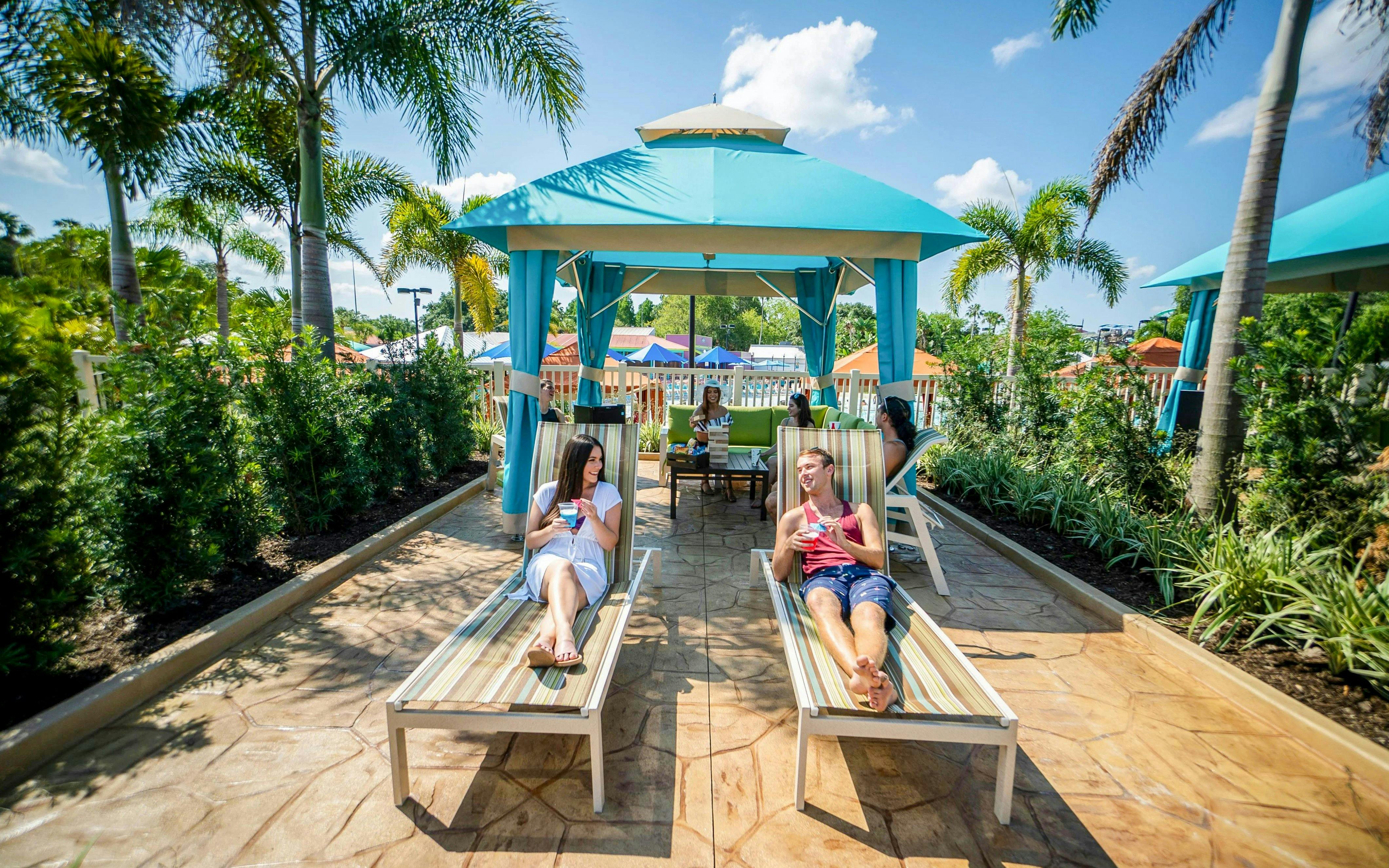 Guests relaxing in a cabana at Adventure Island, Tampa.