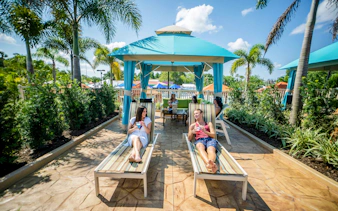 Guests relaxing in a cabana at Adventure Island, Tampa.