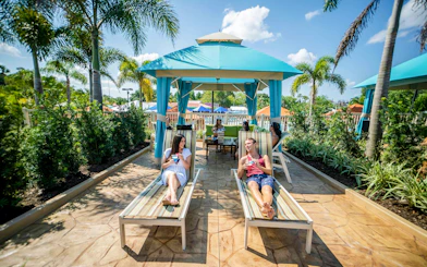 Guests relaxing in a cabana at Adventure Island, Tampa.