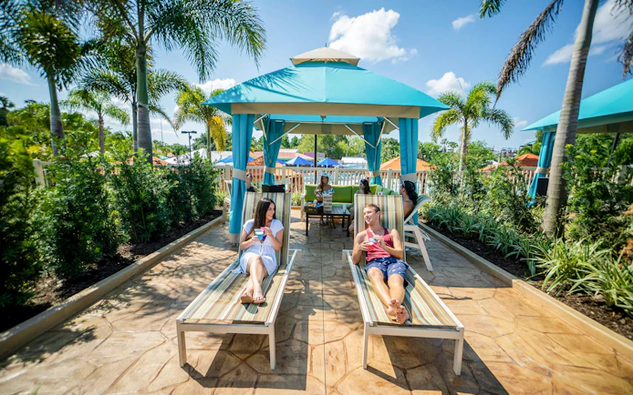Guests relaxing in a cabana at Adventure Island, Tampa.