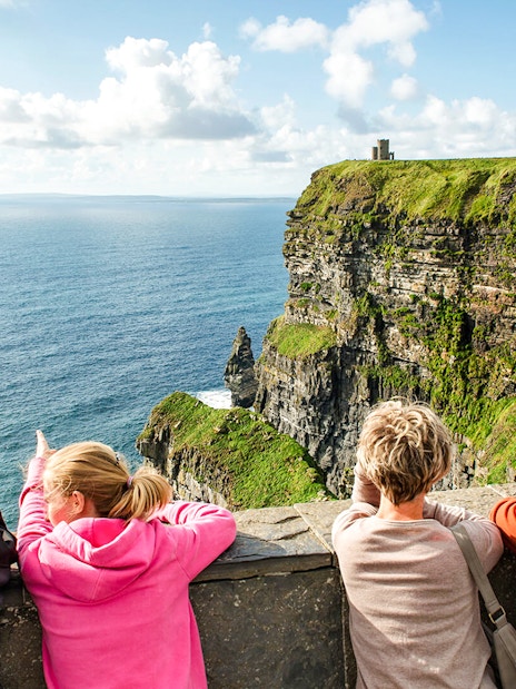 Tourists viewing the Cliffs of Moher in County Clare, Ireland.