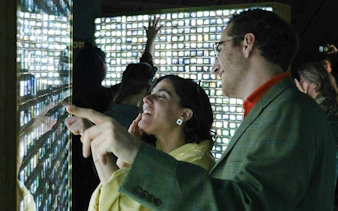 Guests interacting with digital exhibits at Fotografiska Berlin.