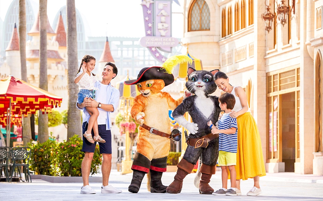 Family meeting characters at Universal Studios Singapore.