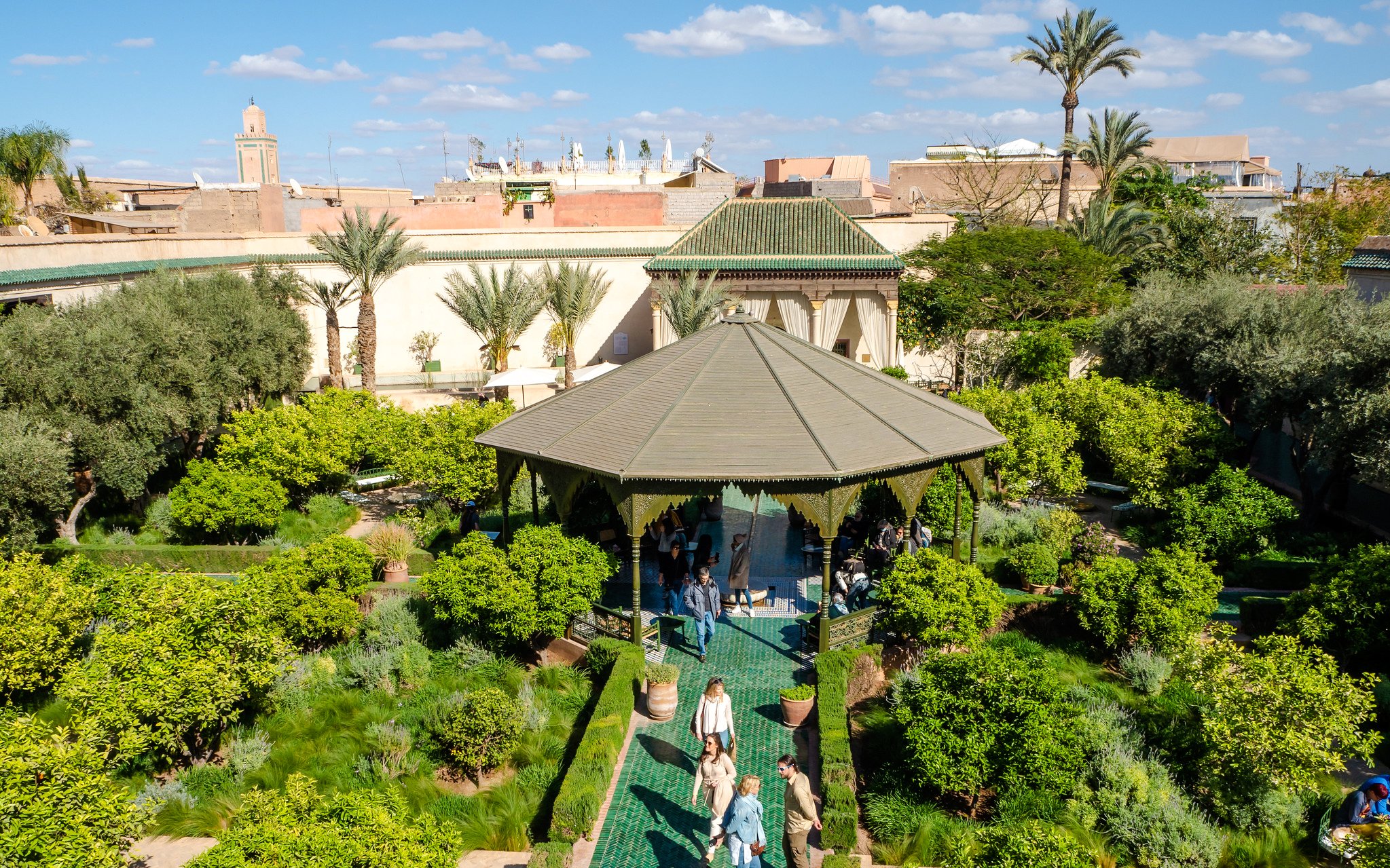 Le Jardin Secret garden with pavilion and visitors, Marrakech.