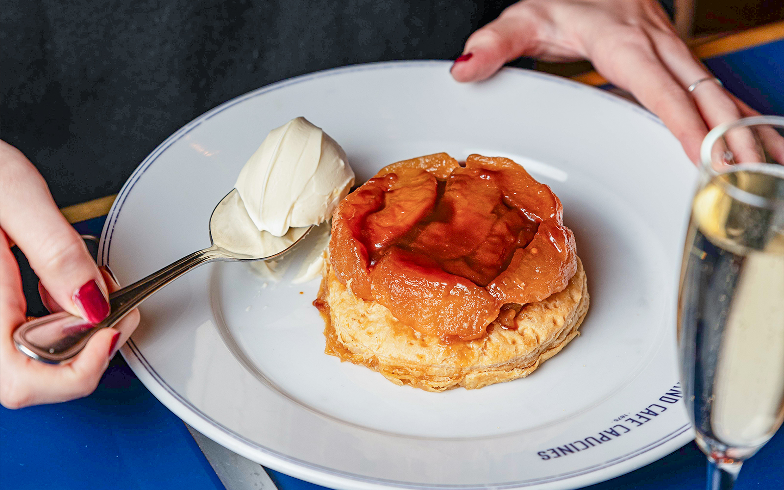 Tarte Tatin with cream served at Opéra-Grand Café Capucines, Paris.