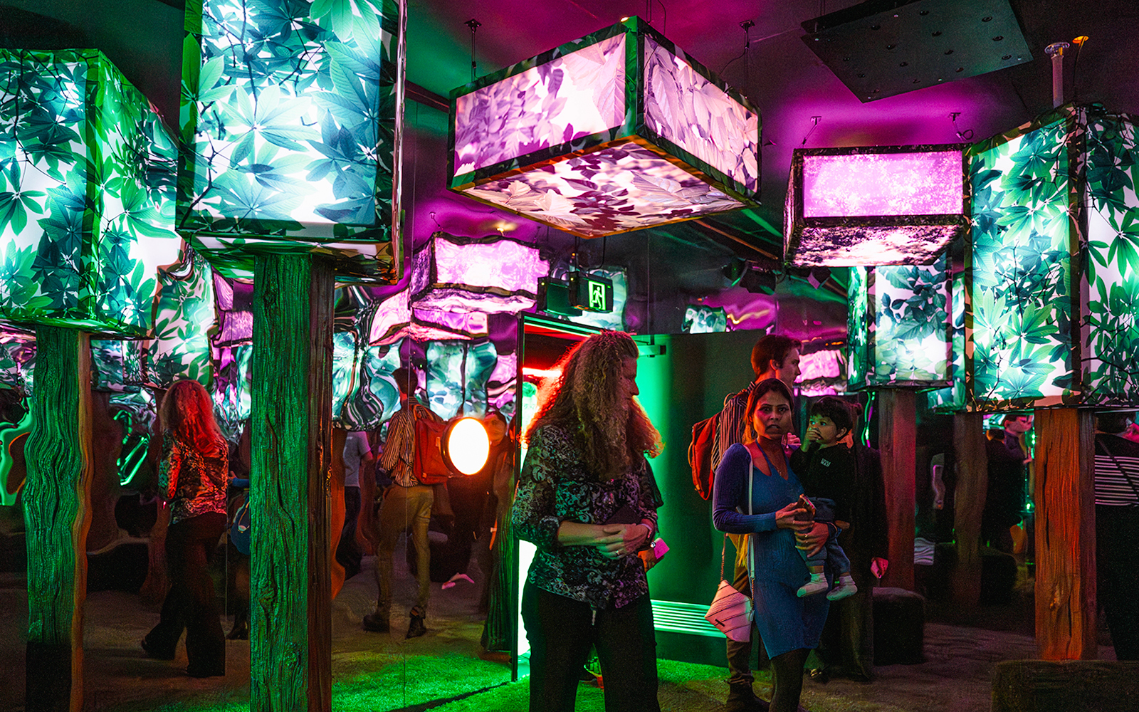 Immersive light installation at Euphoria Grove, Dopamine Land with visitors exploring.