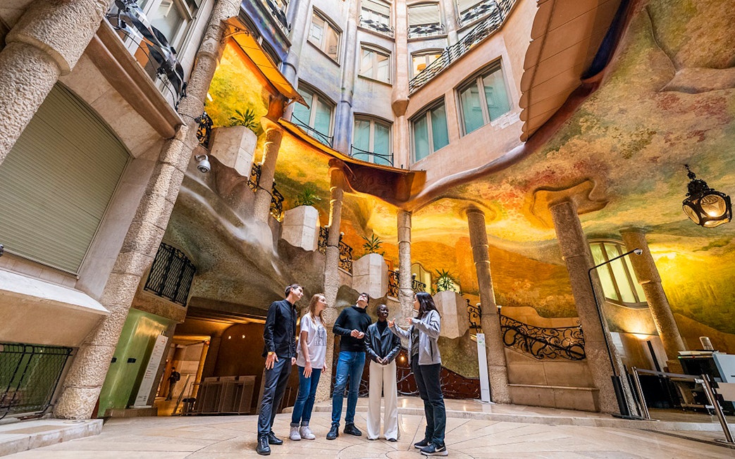 Visitors exploring Casa Milà's interior during La Pedrera Sunrise Tour in Barcelona.