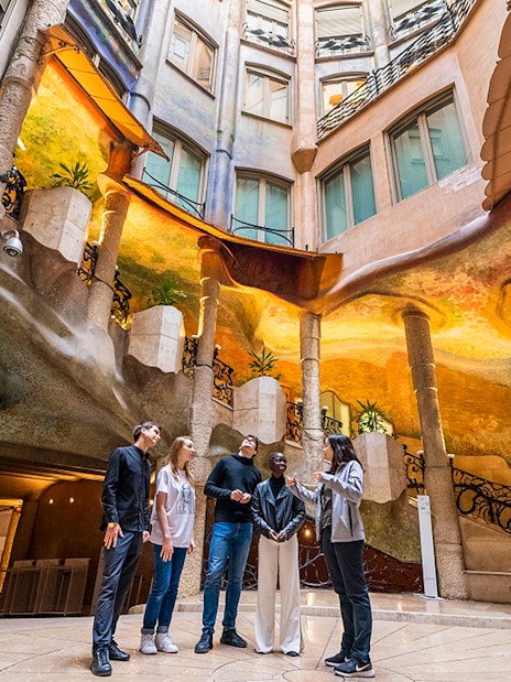 Visitors exploring Casa Milà's interior during La Pedrera Sunrise Tour in Barcelona.