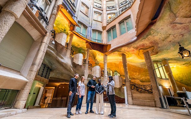Visitors exploring Casa Milà's interior during La Pedrera Sunrise Tour in Barcelona.