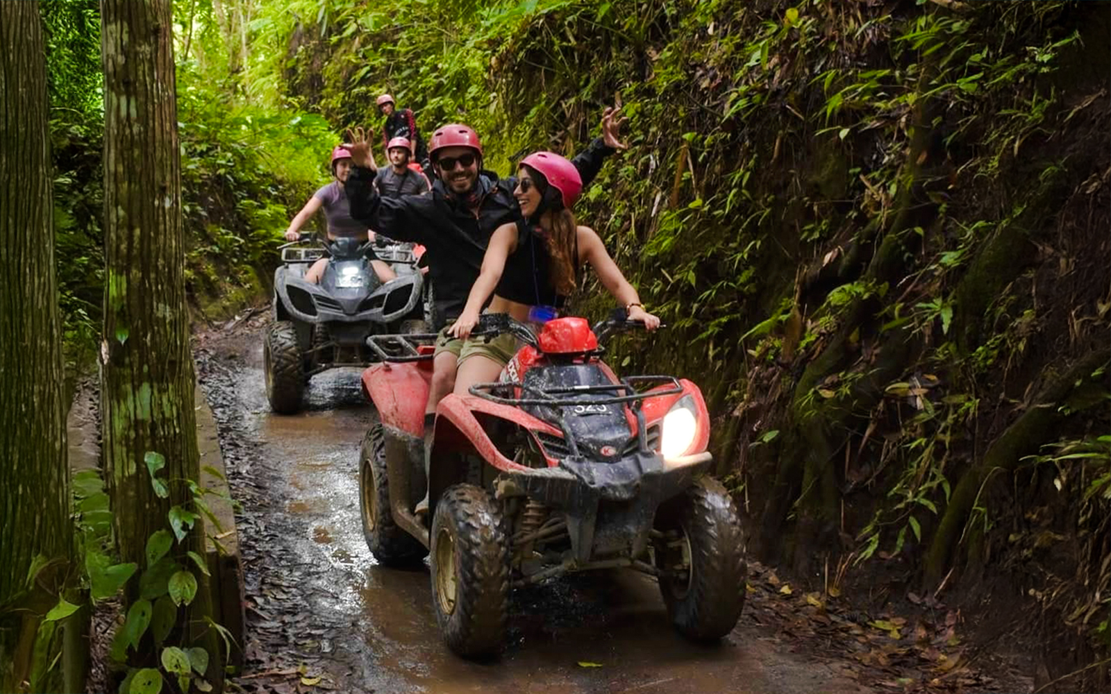 ATV riders navigating a lush forest trail near Kuber long tunnel.