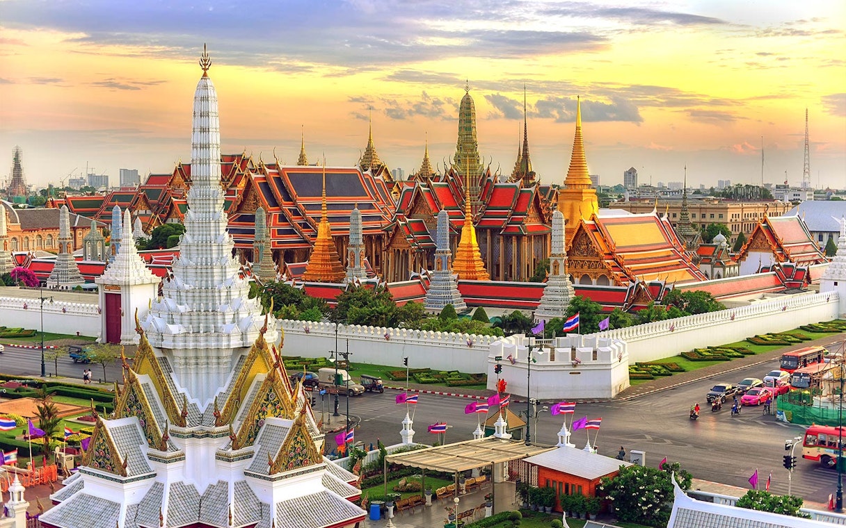 Grand Palace in Bangkok at sunset, view from Hop-On Hop-Off Bus route.