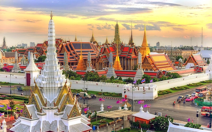 Grand Palace in Bangkok at sunset, view from Hop-On Hop-Off Bus route.