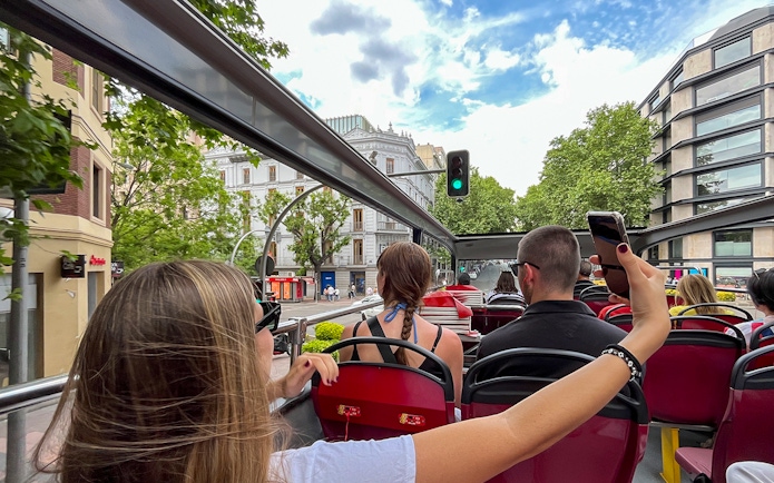 Open-top bus view of Madrid cityscape on City Sightseeing Madrid Hop On Hop Off tour.