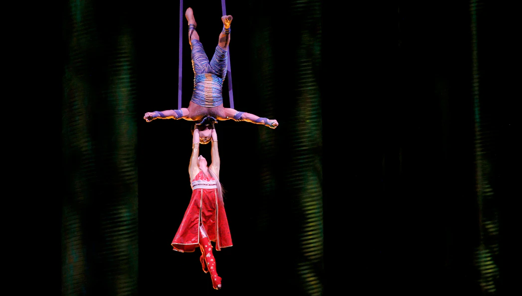 Acrobats performing aerial act in Cirque du Soleil KÀ show.