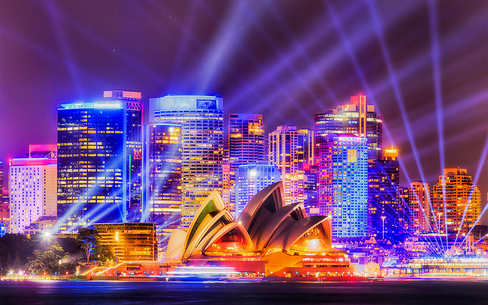 Sydney Opera House illuminated during Vivid Sydney light festival cruise.