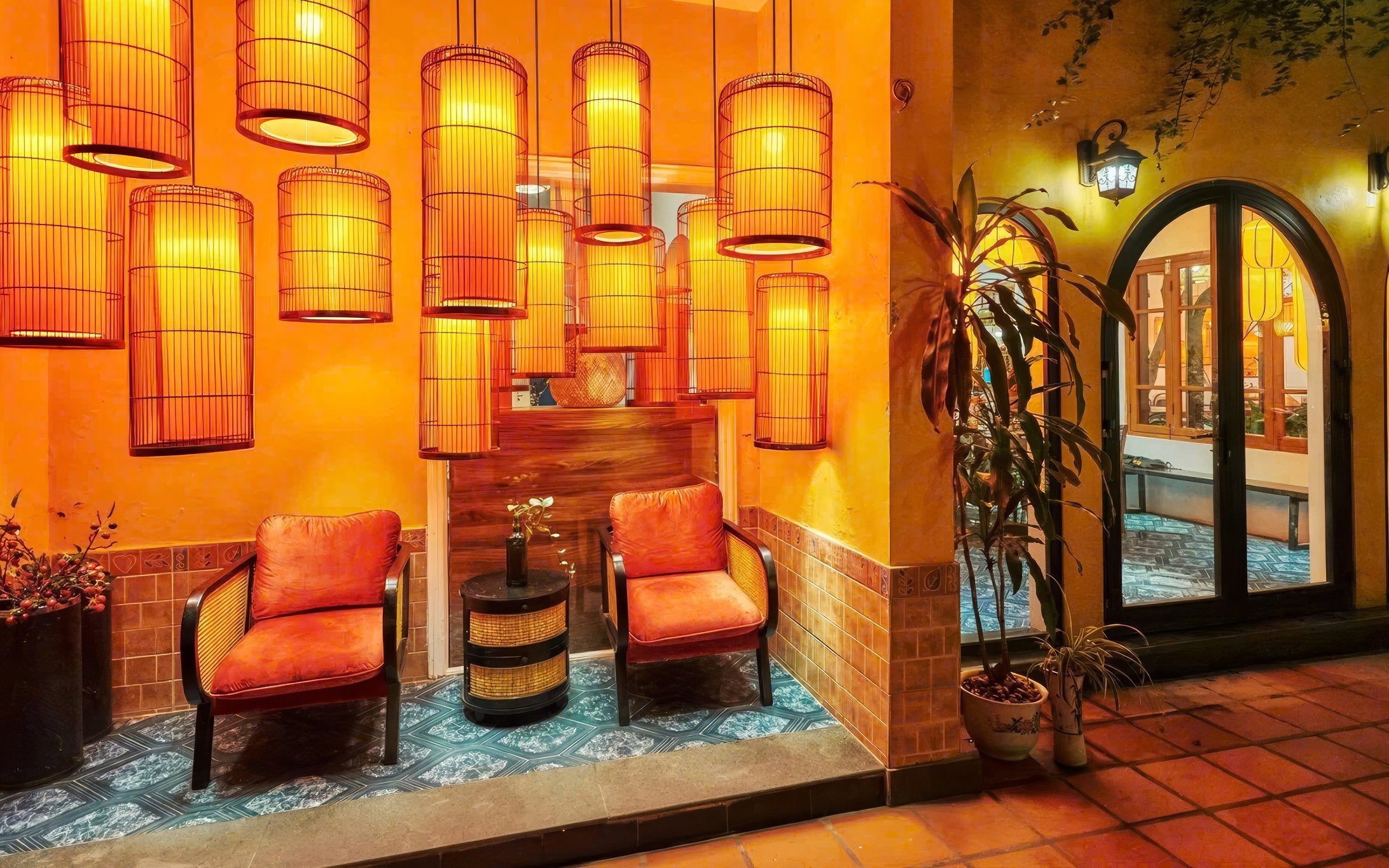 Traditional Vietnamese cooking class setting with lanterns and seating area.