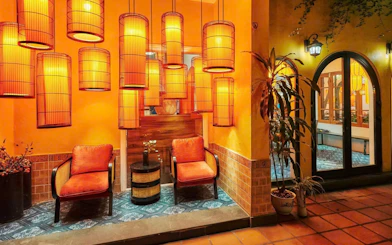 Traditional Vietnamese cooking class setting with lanterns and seating area.