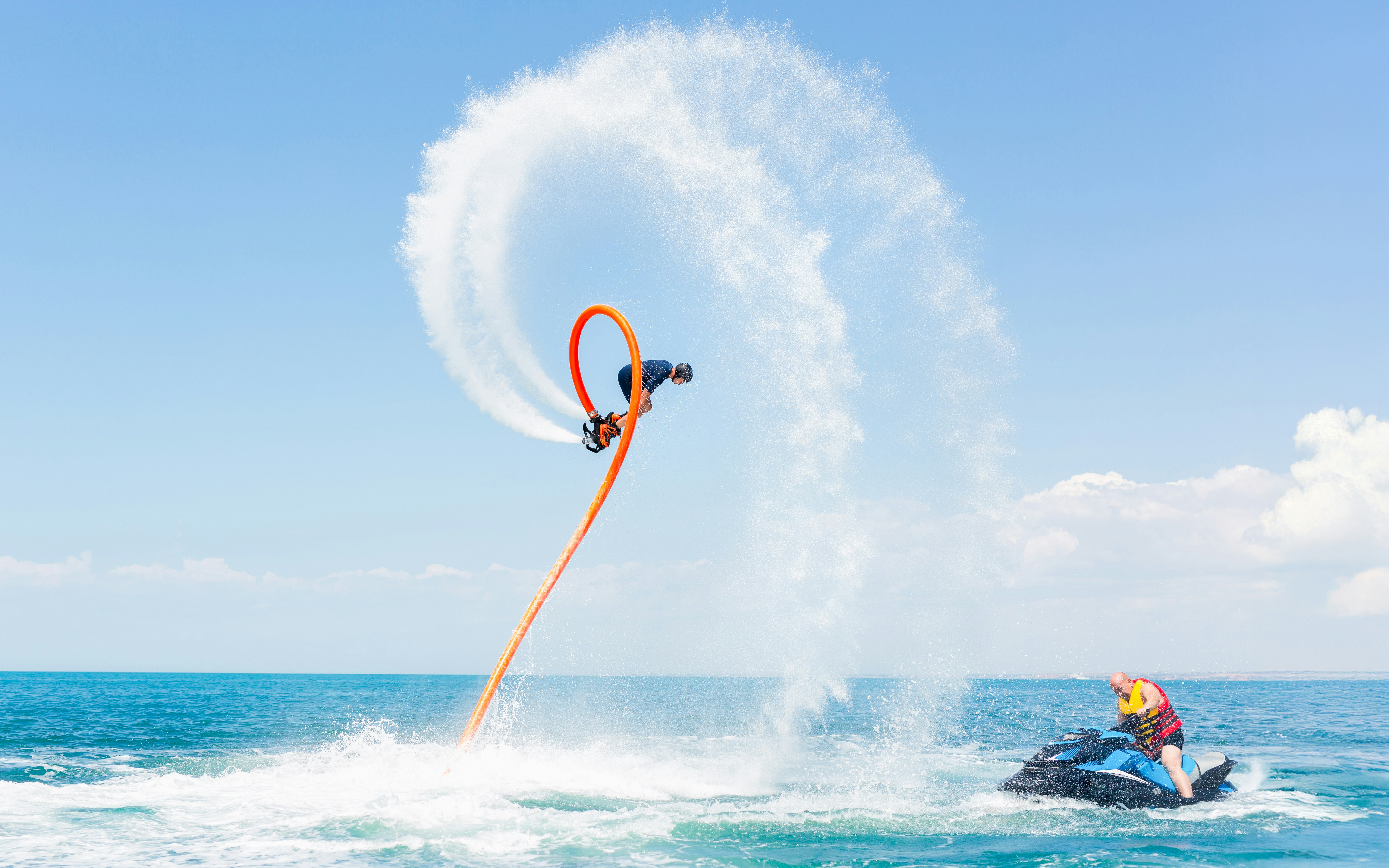 A man flies on a water flyboard