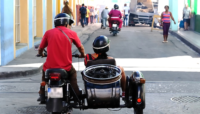 Vintage sidecar parked near Notre Dame Cathedral in Paris.