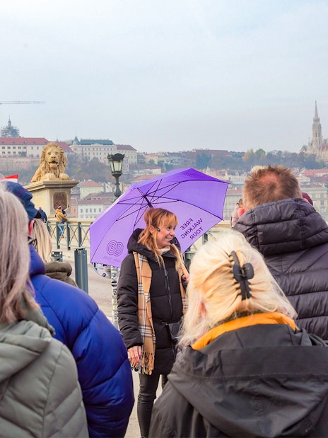 Group tour on Budapest's Chain Bridge with views of the Hungarian Parliament.