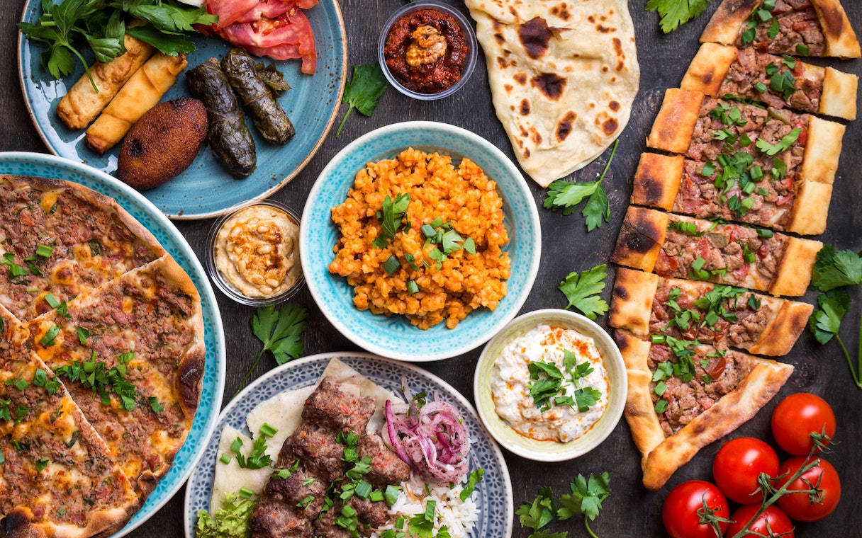 Turkish cuisine spread with kebabs, pide, and meze near Hagia Sophia, Istanbul.