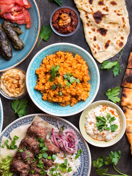 Turkish cuisine spread with kebabs, pide, and meze near Hagia Sophia, Istanbul.