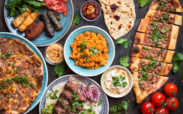 Turkish cuisine spread with kebabs, pide, and meze near Hagia Sophia, Istanbul.