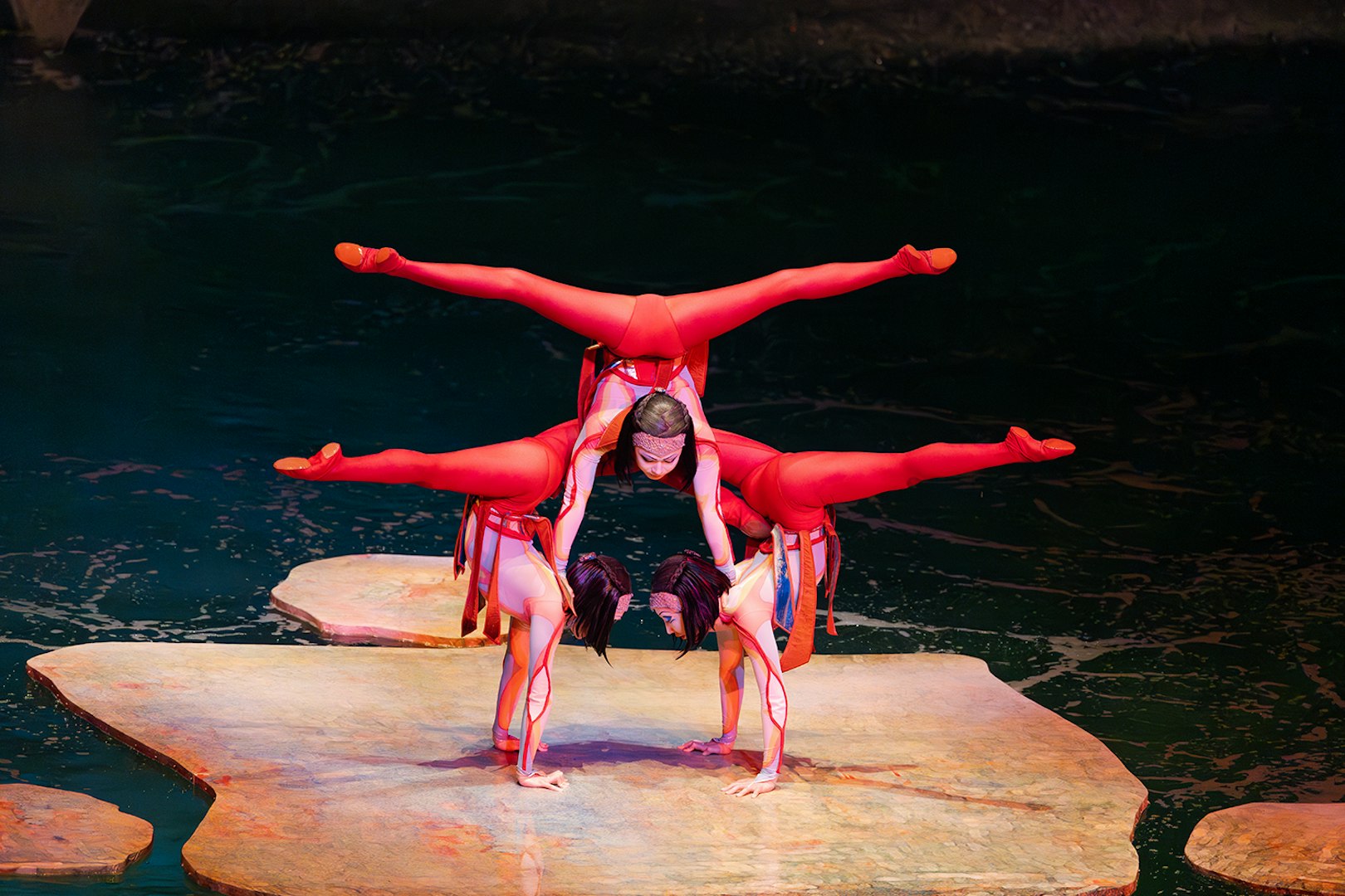 Acrobats performing a balancing act on stage at the O show in Las Vegas.